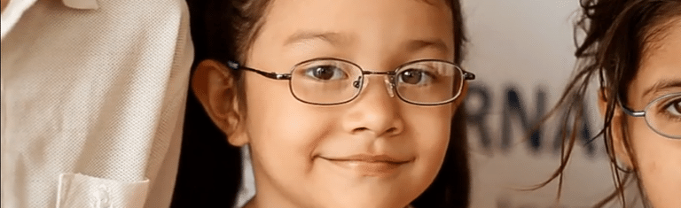 CBI 2021 Year-End Giving image of a child with glasses smiling